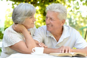 Elderly couple sitting at table